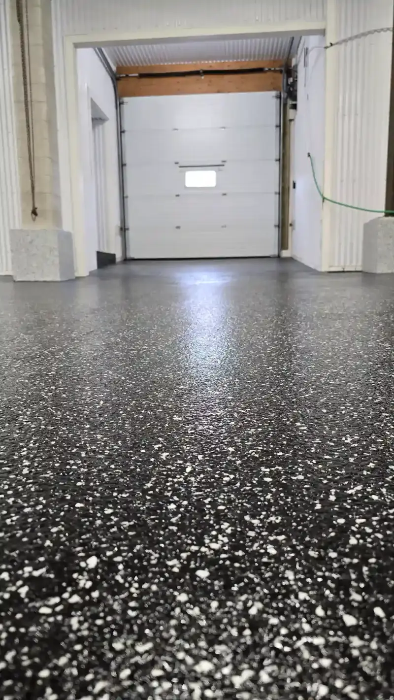 Black flake epoxy floor in a commercial shop