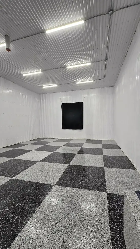 Checkered custom epoxy floor in a commercial shop