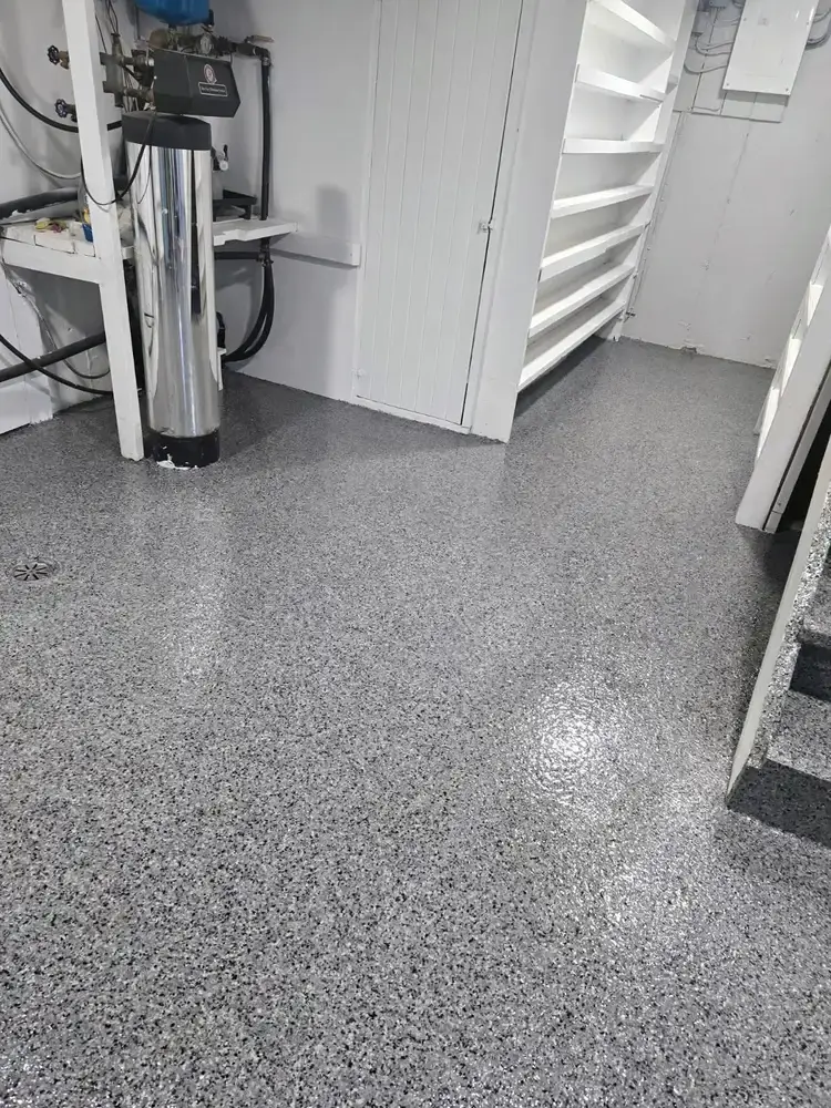 Grey flake epoxy floor in a basement utility room