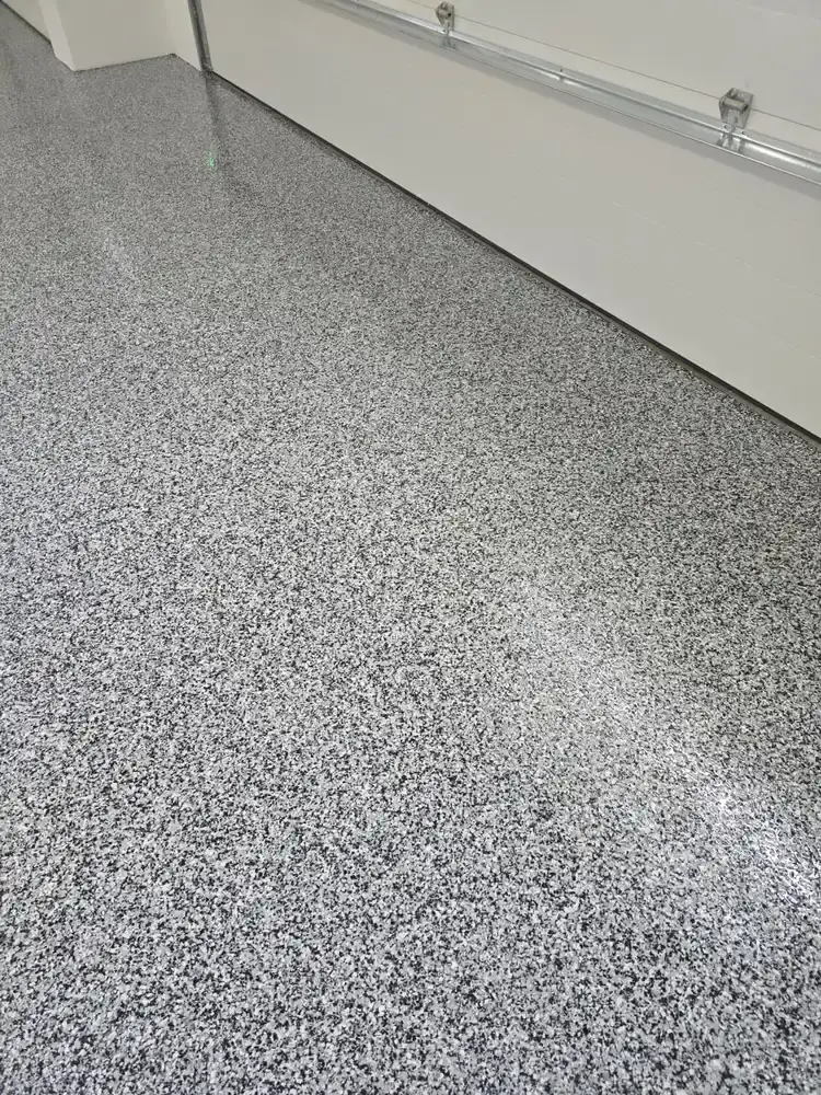 Light grey flake epoxy floor in a residential garage