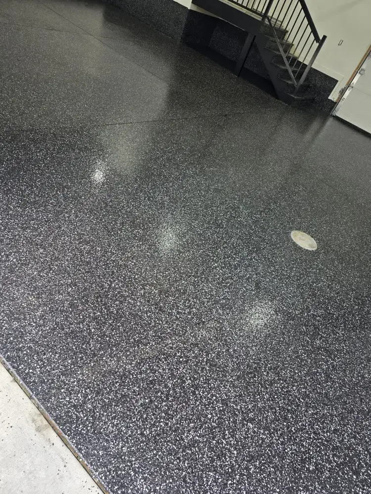 Raven flake epoxy floor in a finished garage