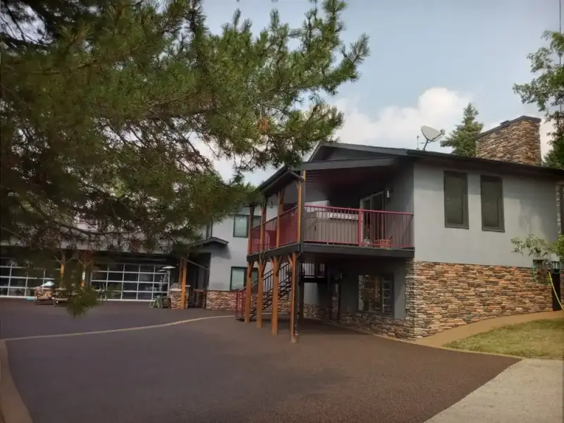 Rubber-paved driveway in front of a two-storey house
